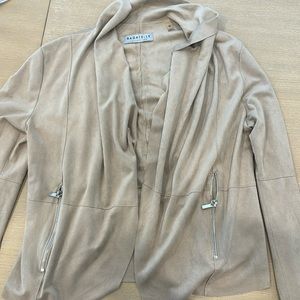 Light tan suede jacket. Hits right at the hips.